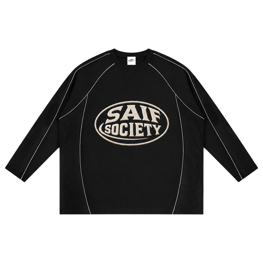 saifsociety The Society Jersey in onyx black with contrast piping, raglan sleeves, and graphic chest branding.