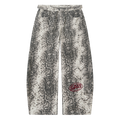 The Python Pants in monochrome snake print with oxblood Saif logo, front view